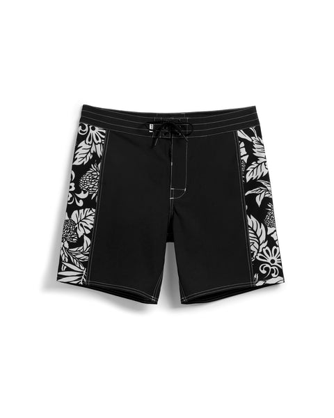 Birdie Boardshorts in black with side paneling with black and white floral pattern. Drawcord with brass grommets.