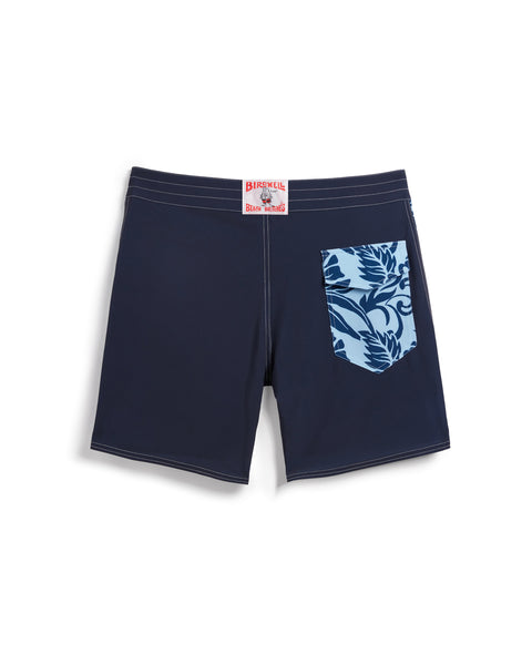 Birdie Boardshorts in navy with side paneling with dark blue and light blue floral pattern. Back pocket on right side with velcro closure. License Plate Label with Birdwell Logo on waistband.