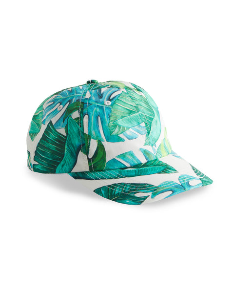 Image shows front view Paradise Snapback. Pattern depicts monstera leaves with white background.
