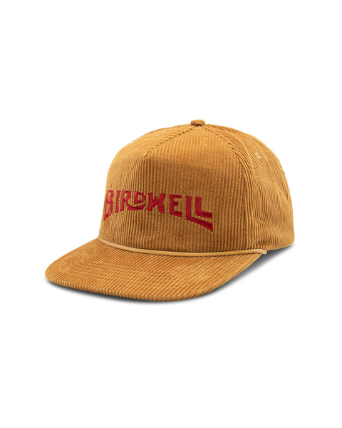 Image shows front of the Wordmark Snapback in deep yellow gold. Embroidered logo on front reads 'Birdwell' in red.