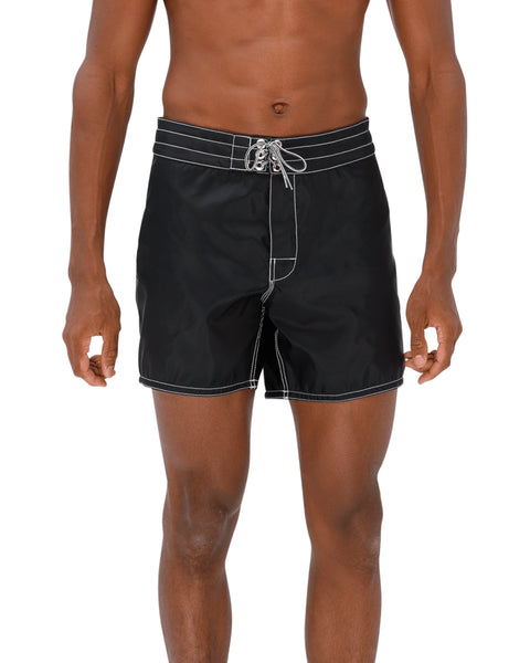 Model wearing the 310 Boardshorts in Black, front view.