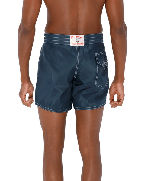 Model wearing the 310 Boardshorts in Navy, back view.