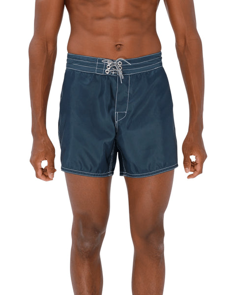 Model wearing the 310 Boardshorts in Navy, front view.