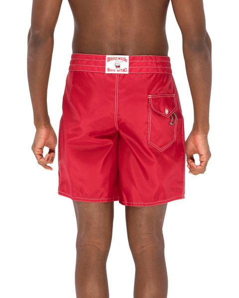 Model wearing the 311 Boardshorts in Red, back view.
