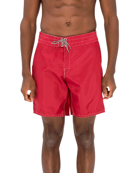Model wearing the 311 Boardshorts in Red, front view.