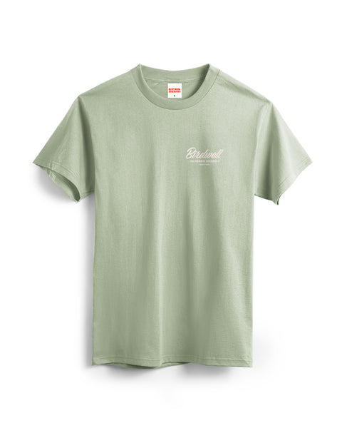 Front View of the Desert Green t-shirt with a Birdwell script logo on a white background.
