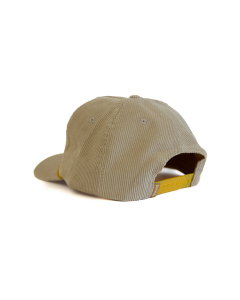 Beige cap with a yellow interior on a white background
