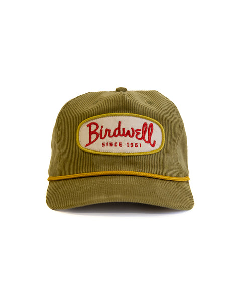 Green cap with 'Birdwell' logo on a white background