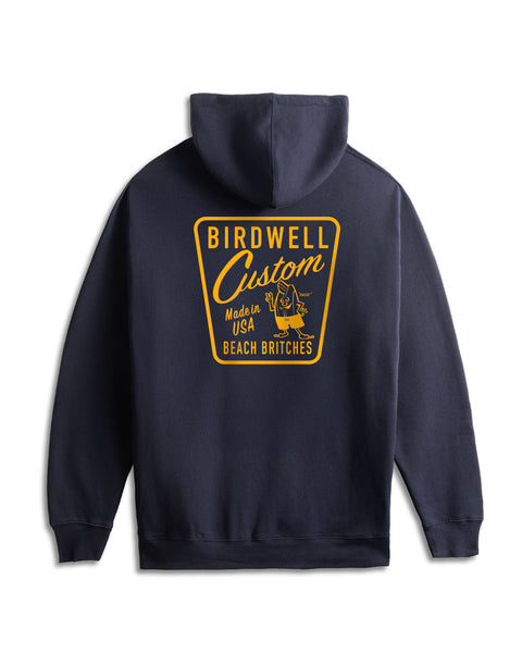 Navy hoodie with yellow 'Birdwell Custom' logo on a white background