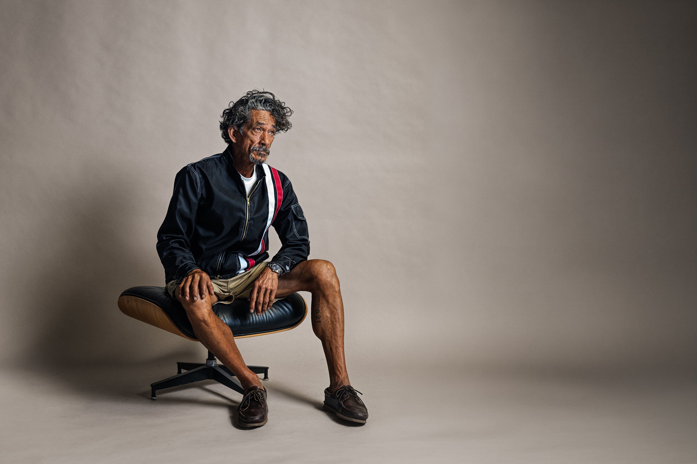 Seated model wearing Birdwell clothing