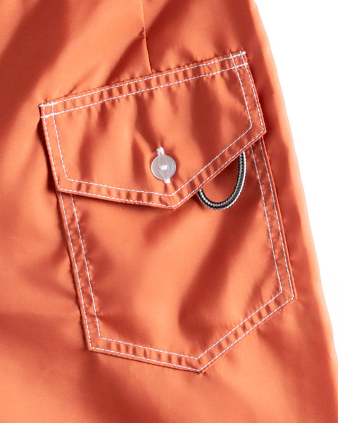 Image shows the back pocket of the 311 Boardshorts in Paprika.