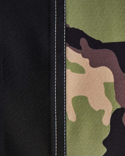 detail panel shot with black fabric on left side, camo on right side with white stitching