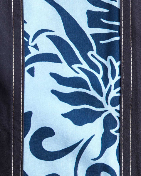 Close up detail of the fabric showing dark blue and light blue floral pattern.