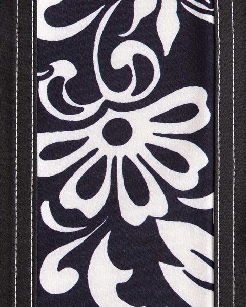 Close up detail of side panel featuring black and white floral pattern.