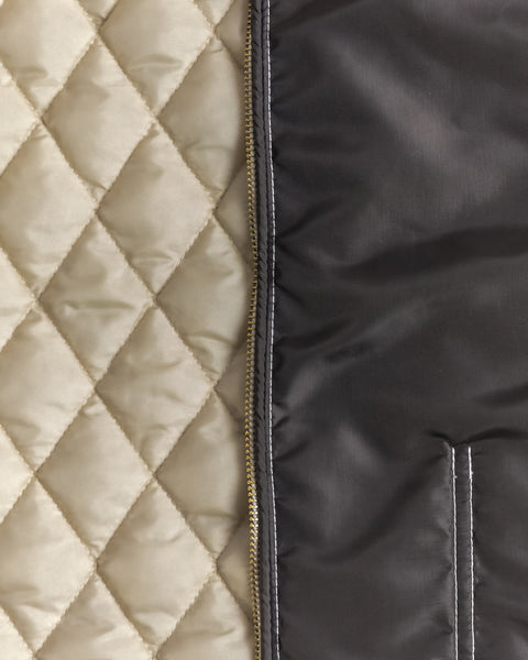 Close-up of the Birdwell Quilted Racing jacket interior of the cream quilt with the talon zipper and diamond pattern