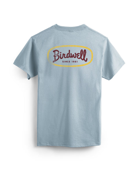 Light blue t-shirt with 'Birdwell' logo on the back against a white background