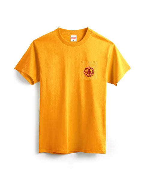 This image is the front of the Shaka short sleeve Pocket T-Shirt in Gold with a logo circle logo of Birdie with a shaka in red on the left chest pcoket against a white background