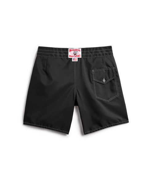 Black shorts with a brand label on a white background