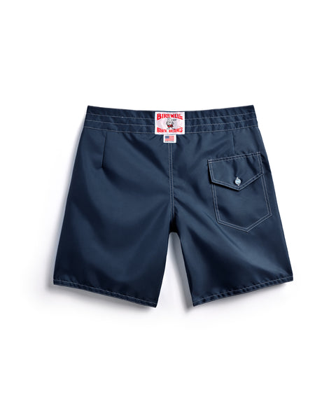 Navy blue shorts with a brand label on a white background