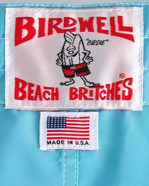 Birdwell Beach Britches label with the Birdie character and American flag on a blue background