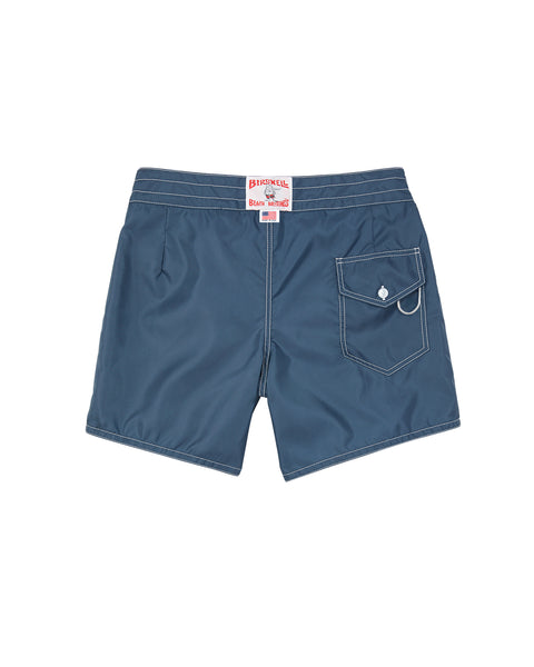 Blue shorts with a brand label on a white background