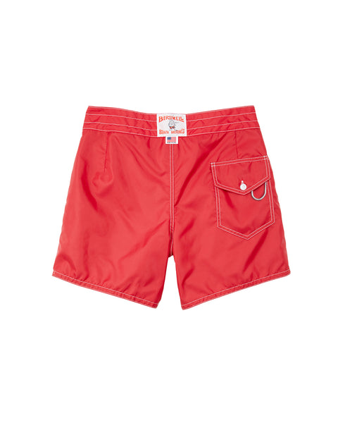 Red shorts with a brand label on a white background