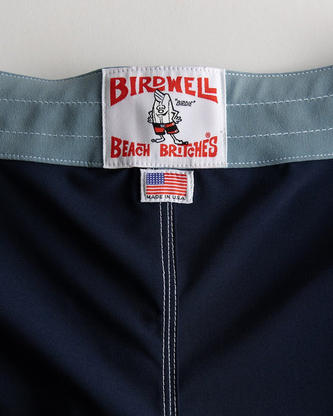 Close-up of a label on a garment with 'Birdwell Beach Britches' branding.