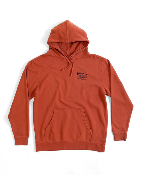 Orange hoodie with a small logo on a white background
