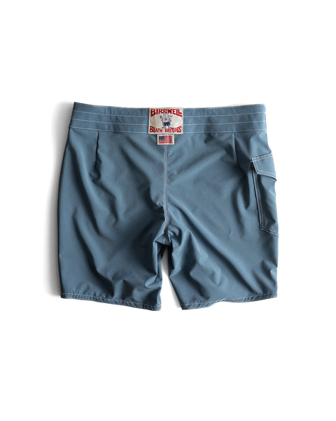 808 Racing Stripes boardshorts in Federal Blue/Bone shown from the back, featuring a right-side flap pocket and red Birnell x Brooks Brothers label on the waistband. Made in USA, displayed against a white background.