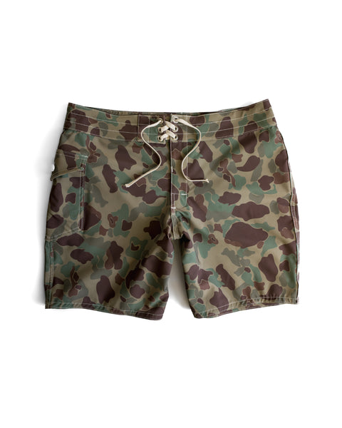 The 808 SurfStretch Side Pocket Boardshorts in Frogskin Camo feature a green and brown camouflage pattern and a white drawstring, shown flat on a white background.