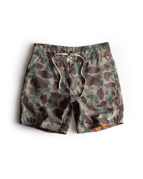 300 Boardshorts - Frogskin Camo, featuring a green and brown camouflage pattern with a white drawstring, shown flat on a white background.