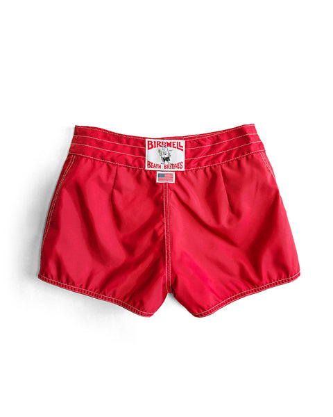 400 Boardshorts - Red: Vibrant red SurfNyl boardshorts with white stitching and a signature Birdwell Beach Britches label on the waistband, shown against a white background.
