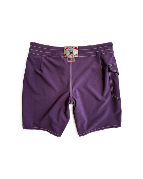 The 808 Racing Stripes boardshorts in purple/gold feature white stitching, a right back pocket, and a rectangular Birdwell Beach Britches label above the waistband. Made in the USA.