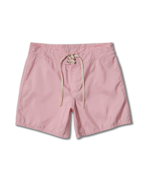 The 310 Boardshorts in Almond Blossom feature an elastic waistband, lace-up front drawstring, and mid-thigh length, shown on a white background.