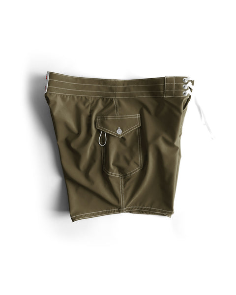 The 806 SurfStretch Side Pocket Boardshorts in Dark Olive are expertly crafted stretch boardshorts, featuring white stitching, a buttoned back pocket with a key loop, and a white lace-up closure on the waistband. Proudly made in the USA, these swim trunks are displayed on a white background.