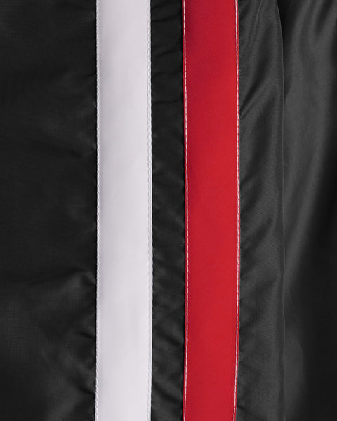 Close-up of the American-made black fabric from the Racing Jacket 26 - Black/White/Red, featuring two parallel vertical stripes—one white and one red. The texture of the fabric and detailed stitching are clearly visible, highlighting its vintage-inspired design.