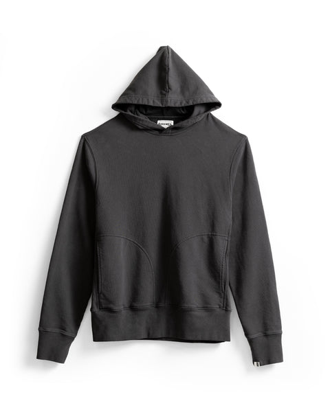 The Harmony Hoodie - Faded Black is a relaxed-fit hooded sweatshirt made from soft French terry, showcasing long sleeves and front pockets, shown against a white background.