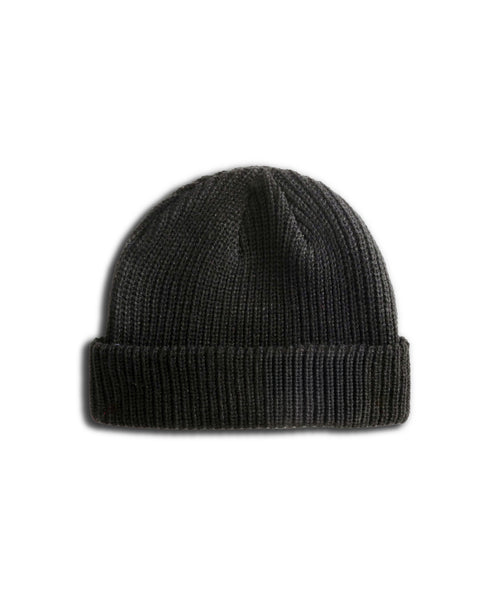 The Powerbird Watchcap - Coal is a black, wide ribbed knit fisherman-style beanie with a folded brim and a subtle Powerbird patch, shown on a white background.