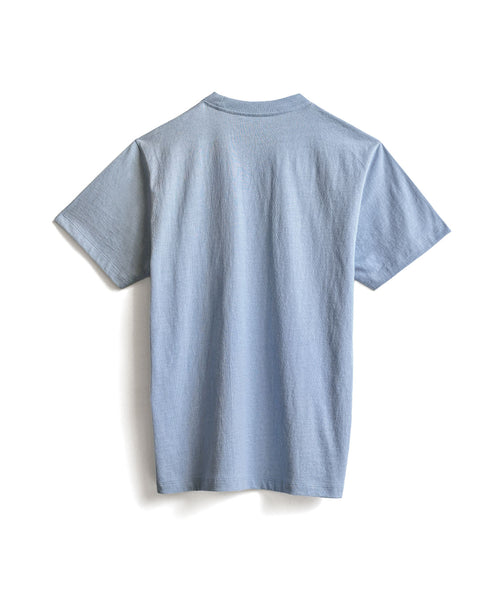 The High Tee Pocket - Arctic Blue, a light blue short-sleeve 100% cotton t-shirt, is displayed on a white background and shown from the back.