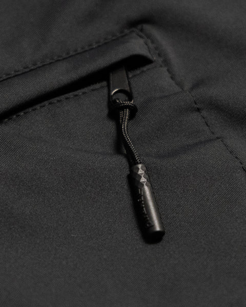 Close-up of the zippered pocket on the Sunteez Hoodie - Black, featuring a black zipper pull with a textured grip—crafted from high-performance, moisture-wicking fabric for superior comfort and durability.