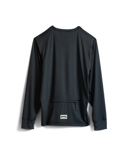 The Sunteez Long Sleeve - Black is shown with its back facing forward, highlighting a small zippered pocket near the bottom hem and a small rectangular label just below it. Made from performance stretch fabric with moisture-wicking properties, this UPF50+ sun shirt delivers comfort and protection for active days.