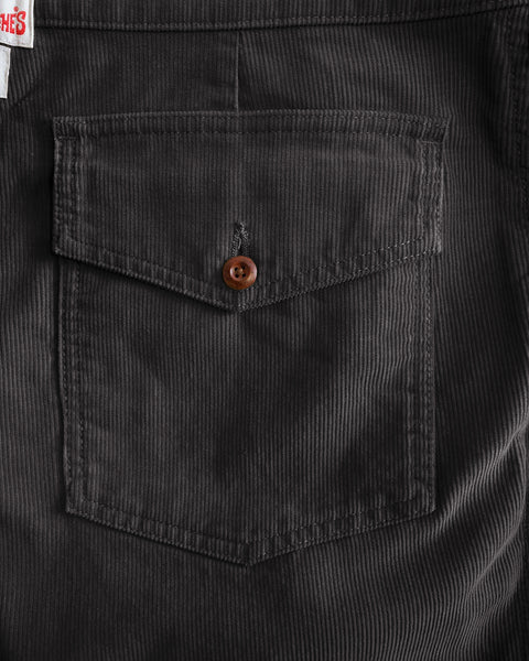 Dark gray corduroy pocket on Classic Corduroy Pants - Charcoal with a single button closure.