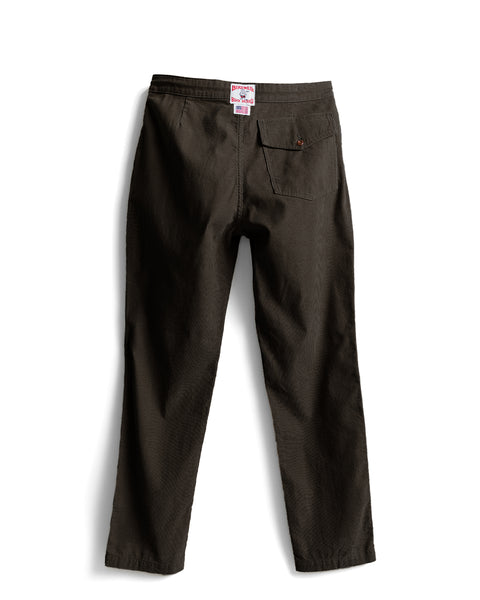 Back view of Classic Corduroy Pants - Brown, featuring a buttoned rear pocket and a brand label at the center of the waistband.