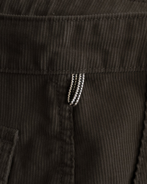 Close-up of brown Classic Corduroy Pants in 100% cotton corduroy fabric with a small, textured fabric loop at the waistband.