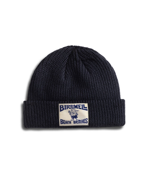 Navy blue License Plate Watchcap - Navy with wide ribbing and a rectangular patch featuring the text Birdwell Beach Britches and an illustrated character.