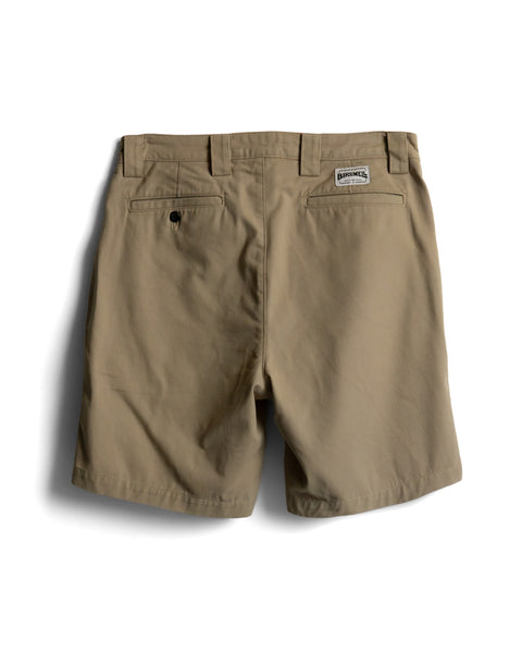 Back view of khaki Stockman Chino Shorts in cotton twill, featuring belt loops, two back pockets, and a brand patch above the right pocket.