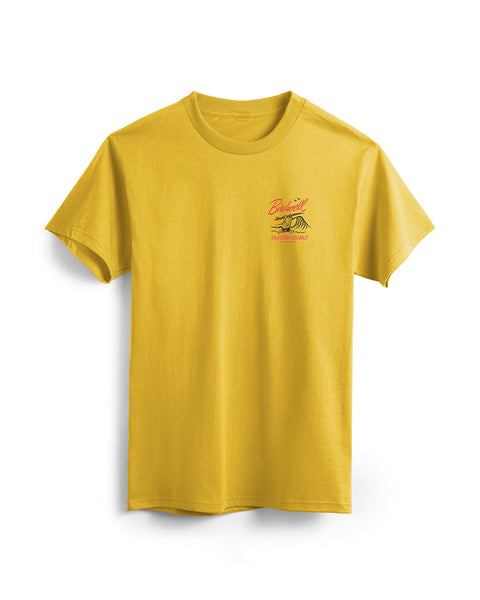 Gold T-Shirt featuring a graphic of birdie mascot running into the waves in red and black. Text featuring “Birdwell” and “California Originals Since 1961.”