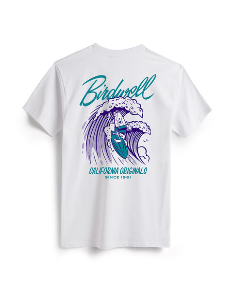 Back of white t-shirt featuring a graphic of birdie mascot surfing on a wave in teal and purple. Text featuring “Birdwell” and “California Originals Since 1961.”