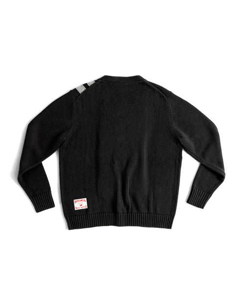 Black sweater with a license plate label on the back against a white background