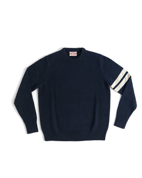 Front View of the Comp Stripe Sweater in Navy with two bone stripes on the left arm. Product on white background.